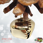 Gold Jingle Bell Detail
Extreme closeup of the metallic gold jingle bell attached beneath the natural pinecone ornament, showing smooth reflective finish and festive holiday charm.