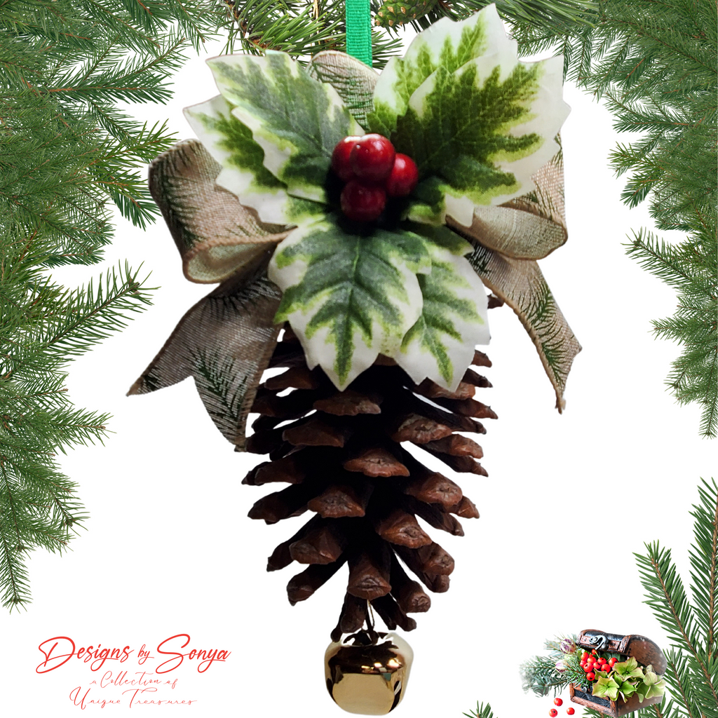 Hanging Ornament with Tree Frame
Pinecone ornament hanging from a green ribbon, decorated with holly leaves, berries and burlap bow, finished with a gold bell; woodland farmhouse Christmas tree décor.