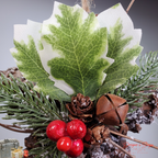 Closeup of Holly Leaves and Ornament Details
Holiday pinecone star ornament showing close detail of variegated holly leaves, red berries, pine accents, and rustic bell charm.