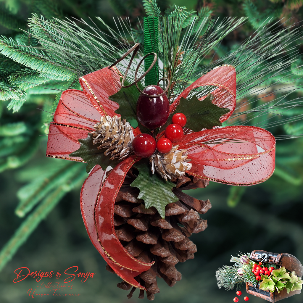 Ornament Hanging on Christmas Tree
Rustic pinecone ornament hanging on evergreen tree branch with red ribbon bow, holly leaves, berries, and snow-dusted pinecones for farmhouse holiday décor.