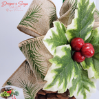 Burlap Ribbon with Pine Print Detail
Detailed view of wired burlap ribbon with green pine needle print and stitched edges layered behind the holly on the pinecone ornament; farmhouse holiday style.