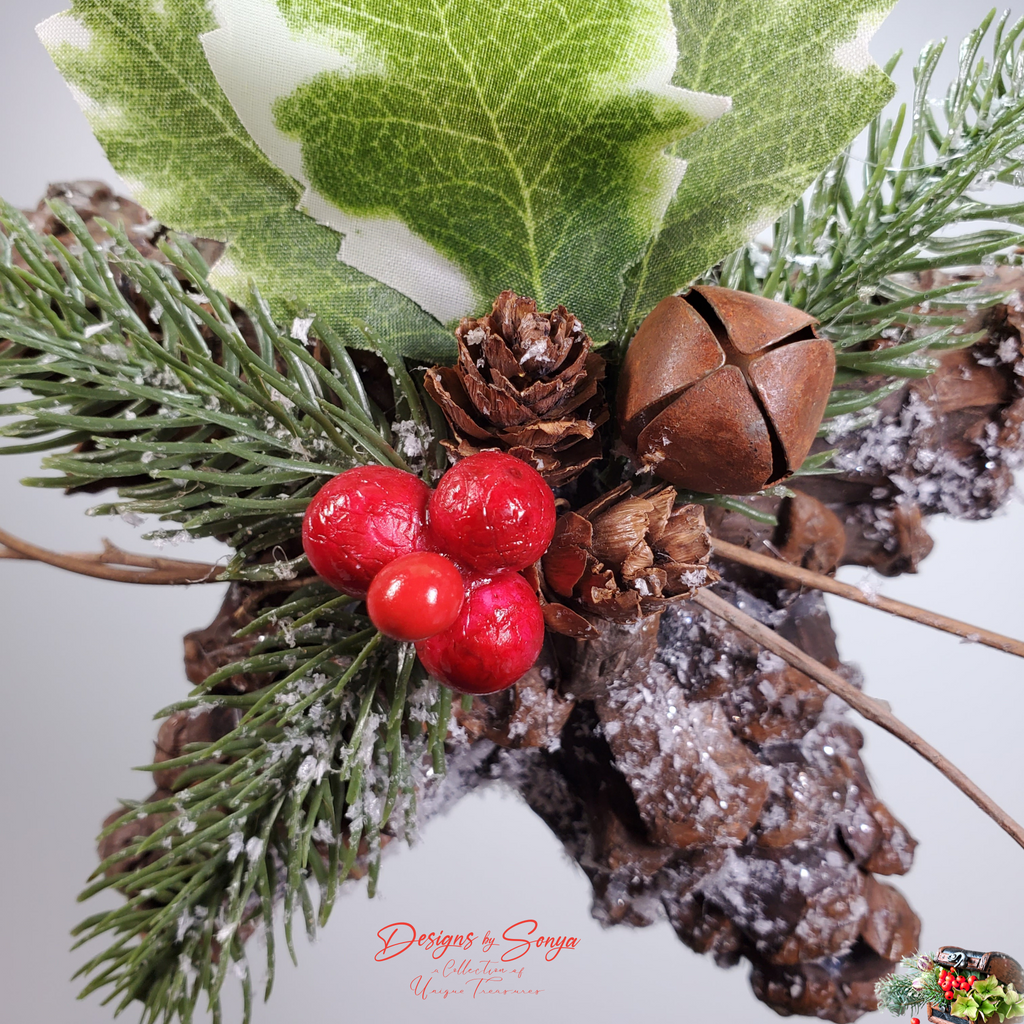 Closeup of Red Berries and Pinecone Ornament
Rustic holiday ornament closeup showing glossy red berries, pine sprigs, rustic bell, and frosted pinecone star details.