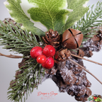 Closeup of Red Berries and Pinecone Ornament
Rustic holiday ornament closeup showing glossy red berries, pine sprigs, rustic bell, and frosted pinecone star details.