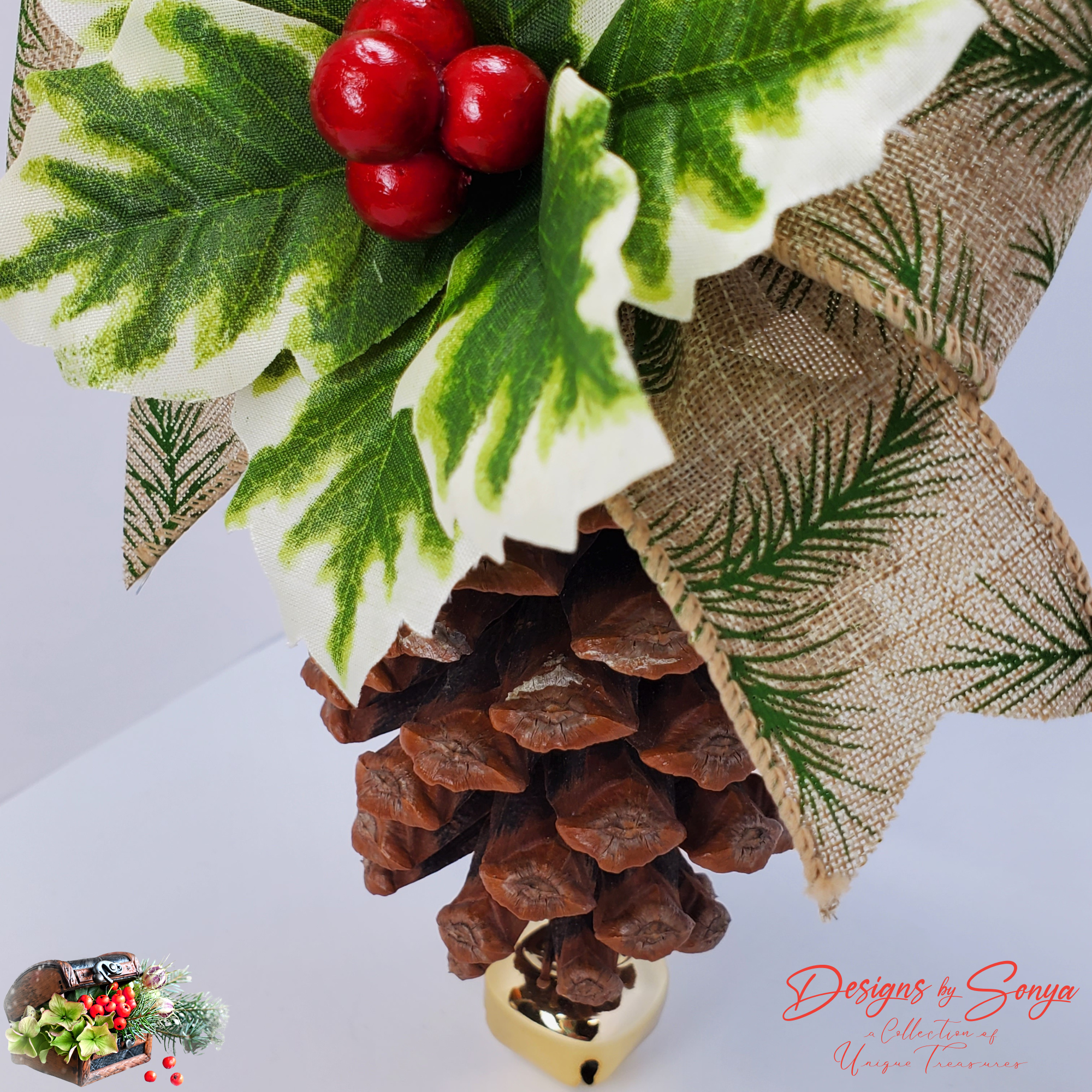 Pinecone Texture and Bell Closeup
Lower section closeup showing natural pinecone scales and the shiny gold jingle bell attached at the base; handcrafted rustic Christmas ornament detail.