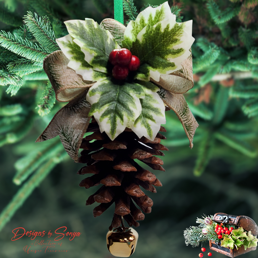 Ornament Displayed on Evergreen
Handmade pinecone ornament with holly, berries, burlap bow and gold bell hanging on a green Christmas tree branch; rustic farmhouse holiday decoration.
