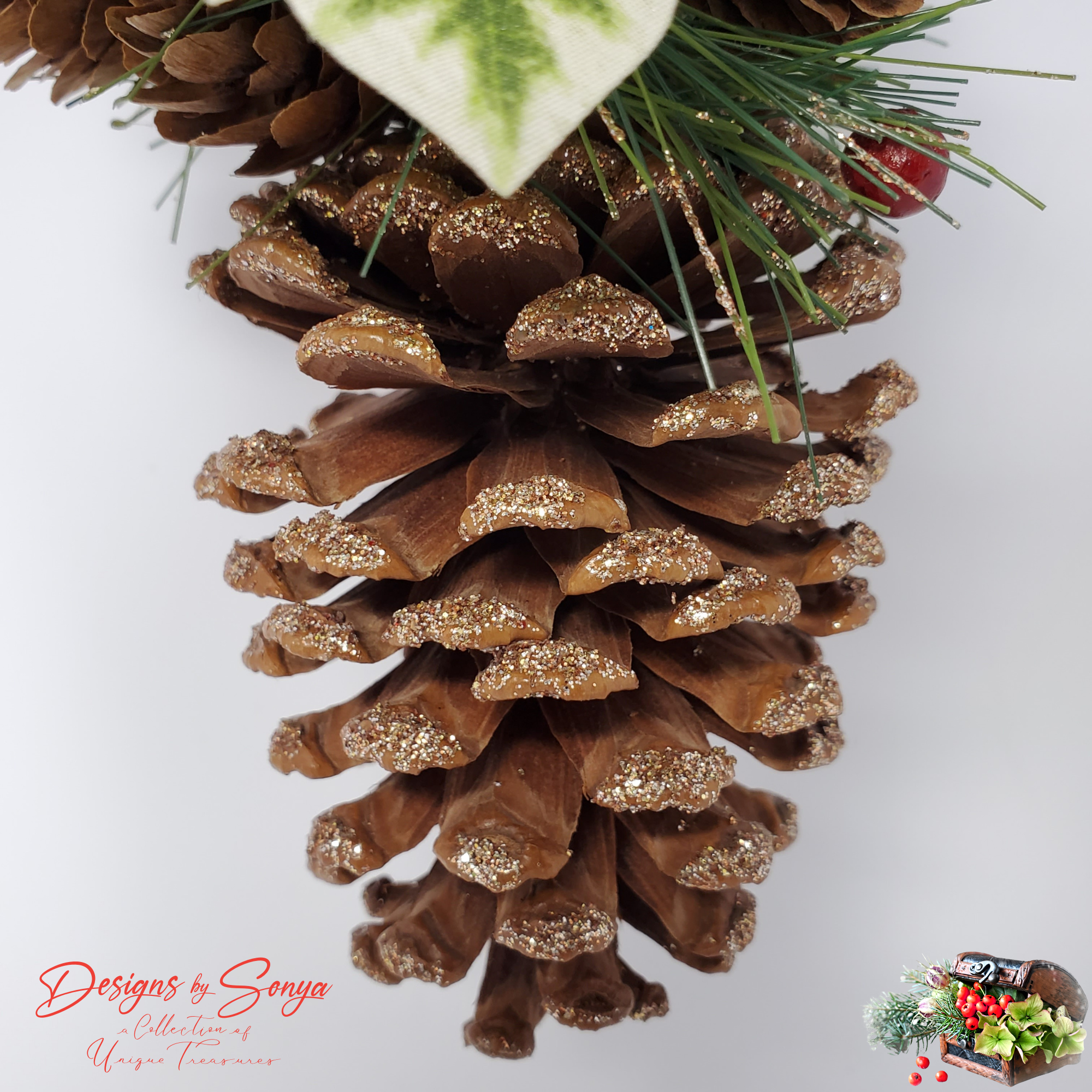 Glitter-Tipped Pinecone Base
Bottom view of a real pinecone with gold glitter tips, part of a handmade Christmas ornament design.