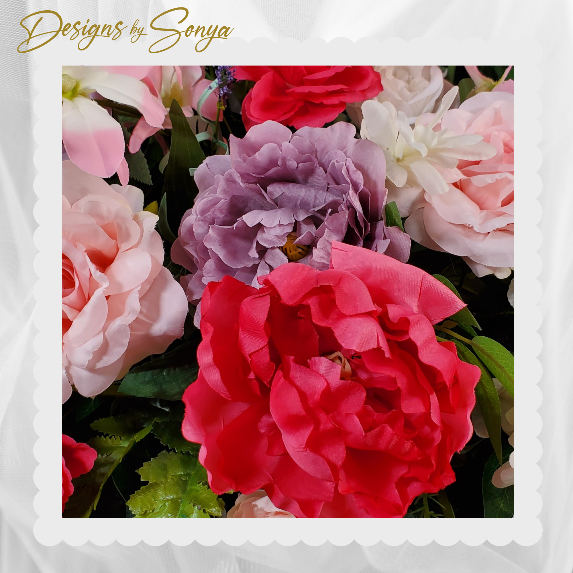Vibrant Peonies and Pastel Blooms
Silk red and lavender peonies surrounded by soft pink roses and orchids, creating a romantic memorial tribute.