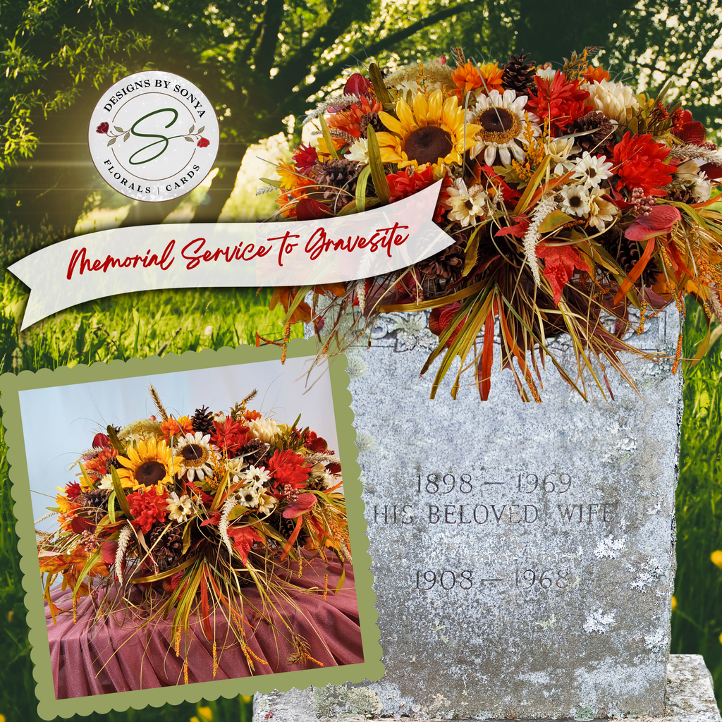 Artificial fall headstone saddle with sunflowers, red dahlias, white daisies, pinecones, wheat, and autumn leaves on a mauve drape.